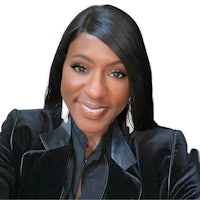 a woman in a black blazer is smiling for the camera